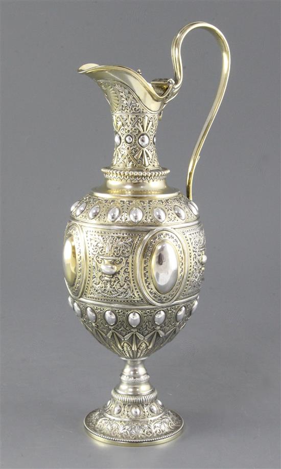 A mid Victorian parcel gilt silver ovoid shaped wine ewer/ claret jug, Height 13 ½”/340mm Weight 23.oz/653grms